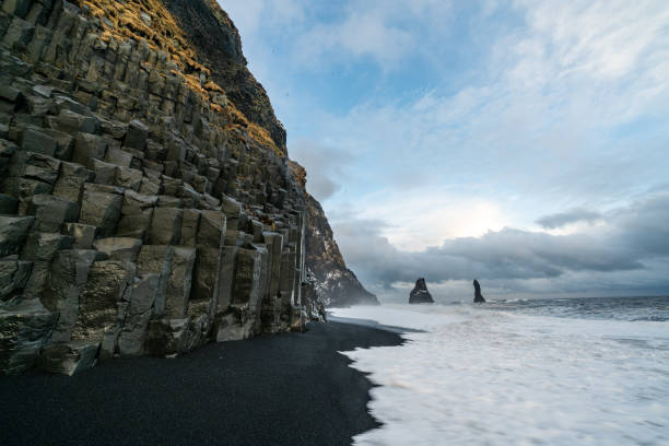 istock Basalt rock formations Troll toes on black beach. at storm Reynisdrangar, Vik, Iceland 1315421253