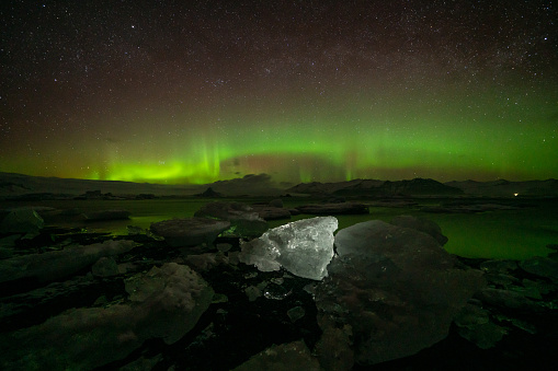 Incredible Aurora Borealis activity above the coast in Iceland.