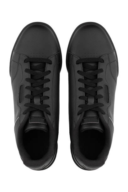 istock Sneakers isolated on white background. Black sneakers close-up on a white background. 1315421455