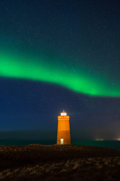 istock Lighthouse on Reykjanes peninsula under nortern lights. Iceland. Timelapse 1315421751