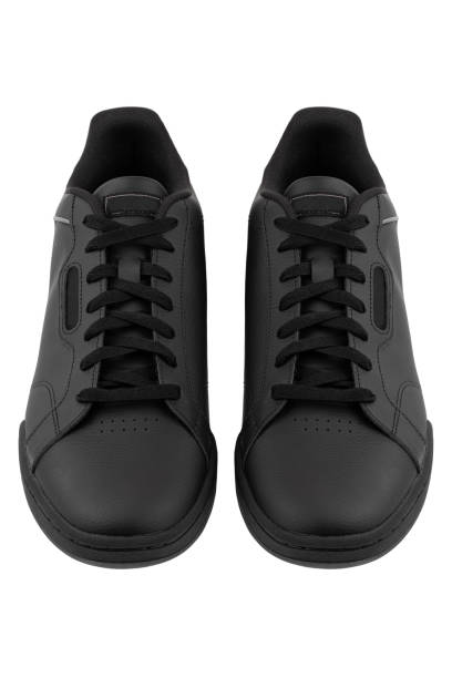 istock Sneakers isolated on white background. Black sneakers close-up on a white background. 1315422023
