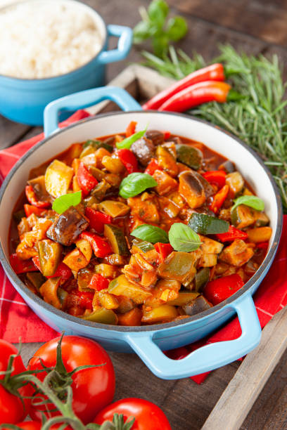 Delicious ratatouille with fresh herbs Delicious ratatouille with fresh vegetables and herbs ratatouille stock pictures, royalty-free photos & images