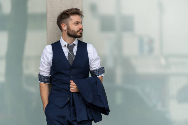 istock Smart dressed businessman wearing earphones 1315426097