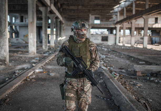 istock Special forces soldier armed with weapons in camouflage uniform on patrol in war zone 1315427352