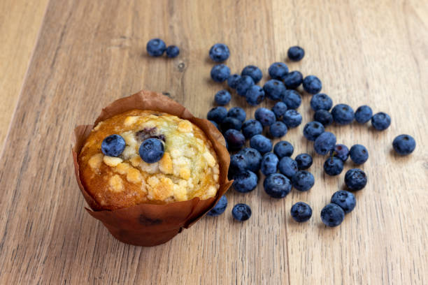 istock blueberry muffins with scattered berries 1315429959