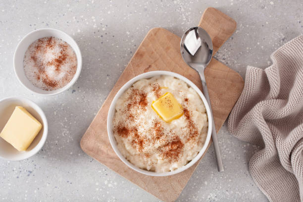 rice pudding with butter cinnamon. french riz au lait, norwegian risgrot, traditional breakfast dessert