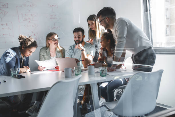 istock Group of programmers an designers in conference room.They discussing about development of new project. 1315431971