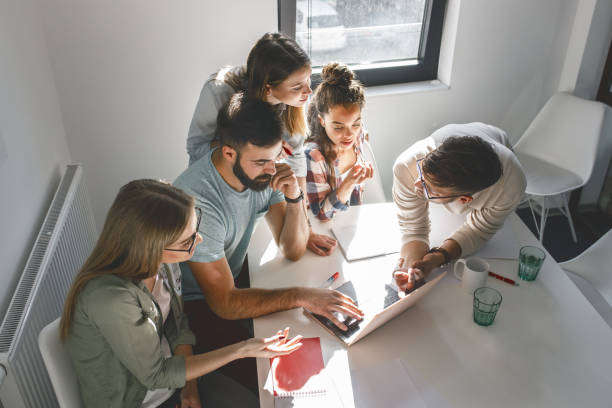 istock Group of programmers an designers in conference room.They discussing about development of new project. 1315432526