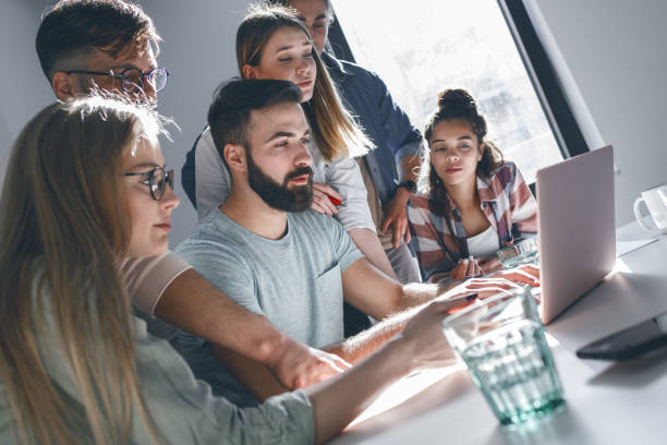 istock Group of programmers an designers in conference room.They discussing about development of new project. 1315432882