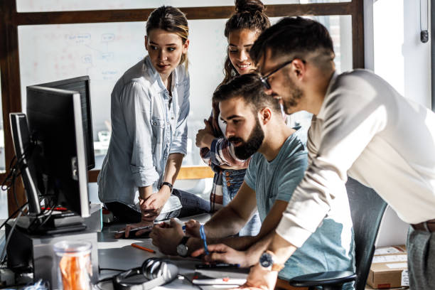 istock Group of designers programmers working on a new project at the office. 1315433027