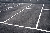 Parking spaces marked on asphalt
