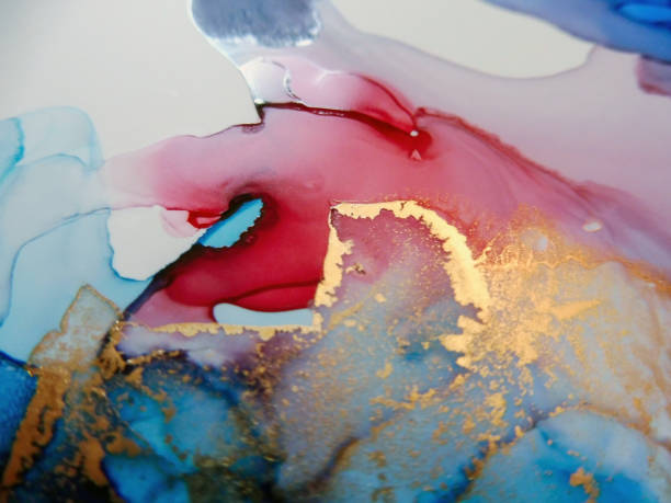 istock Gold foil paint on red and cyan marble ink texture. 1315435005