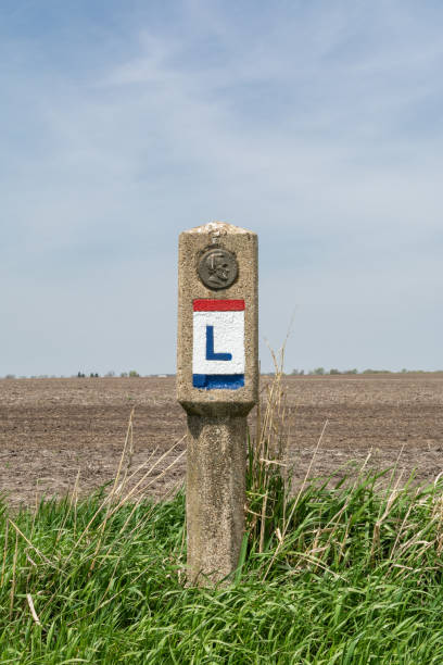 Lincoln highway marker in the spring sunshine.  Franklin Grove, Illinois, USA.