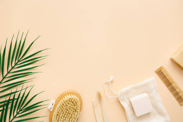 istock Eco-friendly bathroom accessories: bamboo toothbrushes, bamboo ear sticks, organic soap, reusable cotton bags on a beige background. Zero waste concept. Zero waste lifestyle. 1315440801