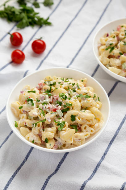 istock Homemade Macaroni Salad in white bowls, side view. 1315442057