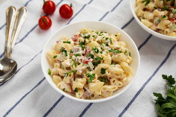 istock Homemade Macaroni Salad in white bowls, side view. 1315442432