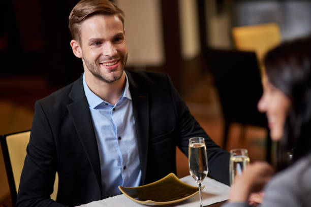 istock Joyous young man having a restaurant date with a woman 1315444247