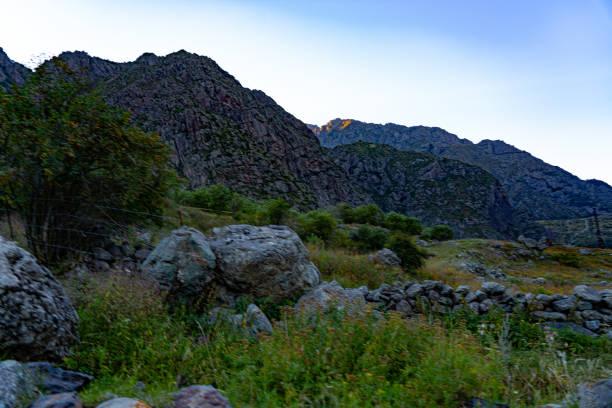istock view of rocks and mountains and grass 1315444787