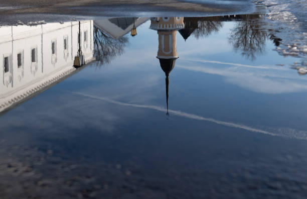 Reflection the city of Klomna in a puddle. Russia