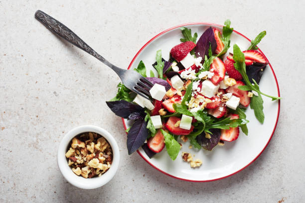 istock Salad with strawberries, arugula and cheese. 1315446793