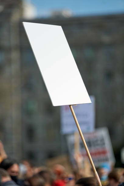 istock Protesters holding placards and signs on the streets. 1315447741