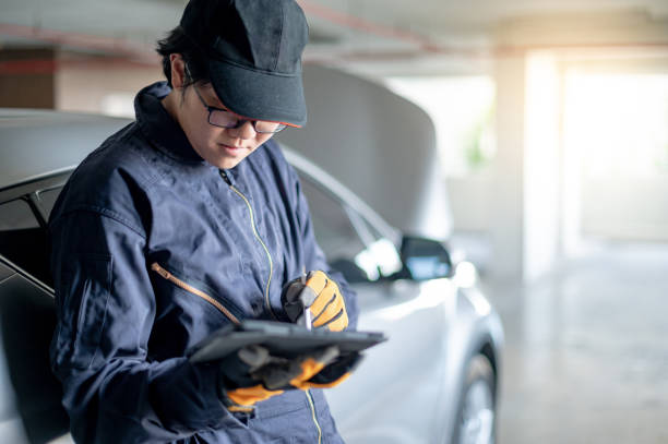 istock Asian auto mechanic checking car in garage 1315449285