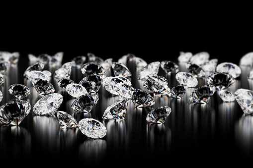 large group of diamonds on black background. Close up image