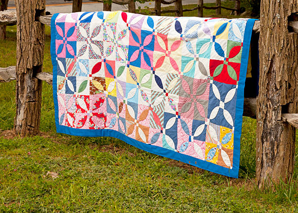 istock Antique quilt on split-rail fence 131545174