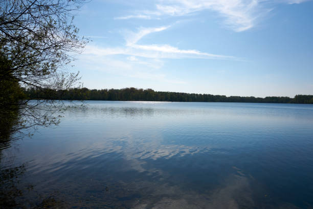 istock blue water quarry pond lake under blue sky and sunshine 1315453438