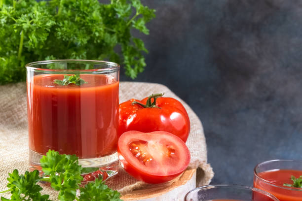 istock Tomato juice. Tomato juice in glasses. Copy space. 1315455228
