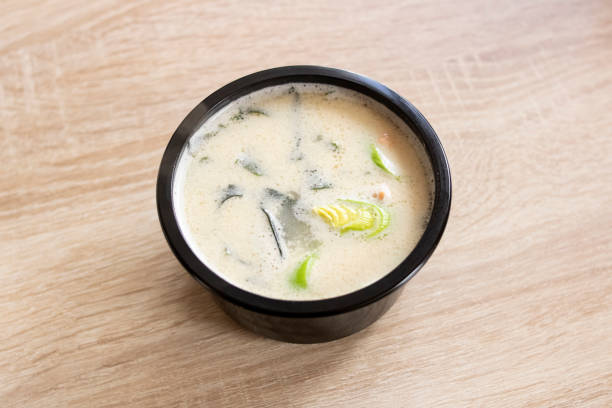 istock Cheese soup in a black bowl on a wooden table 1315457454
