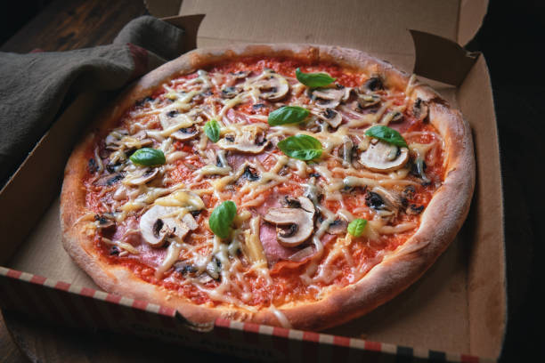 istock Pizza with Mushrooms and Fresh Basil 1315458231