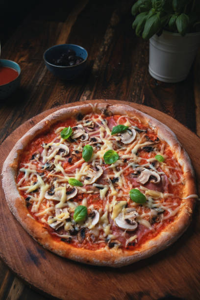 istock Pizza with Mushrooms and Fresh Basil 1315458275