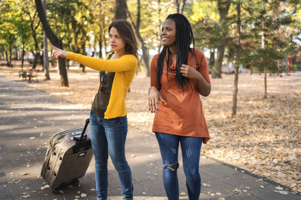 istock Multi ethnic friends tourists with luggage 1315460424