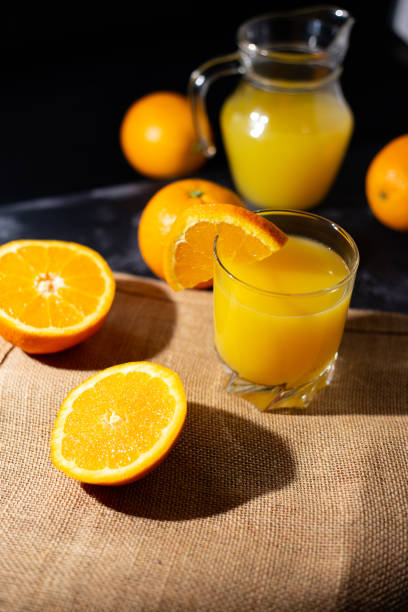 istock table full of fresh oranges and juice in springtime 1315463589