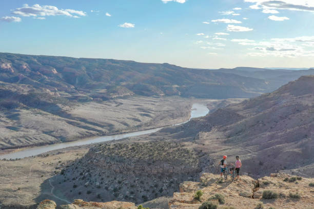Aerial view of mountain bikers relaxing at viewpoint