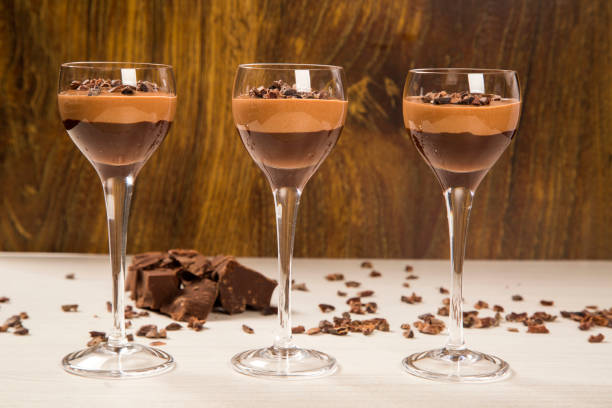 istock Chocolate mousse in a glasses on a wooden background 1315466036