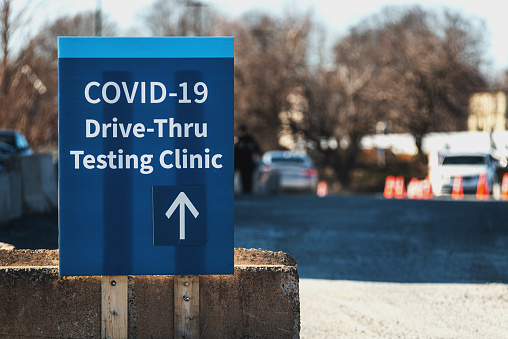 Signage for a Covid-19 drive thru testing clinic.