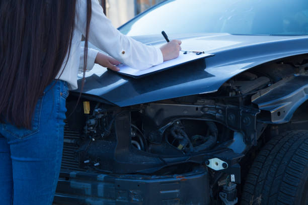 istock Car crash accident. Broken car and agent. 1315468953