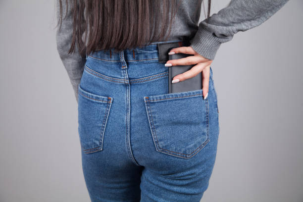 istock Woman puts the mobile phone in her pocket. 1315468997