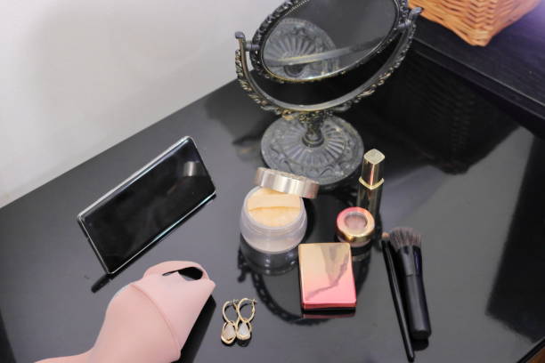 istock Makeup items on the table, antique mirrors, smartphones, masks and accessories 1315469310