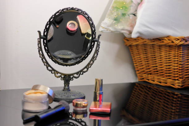 istock Makeup items and antique mirrors on the table 1315469391