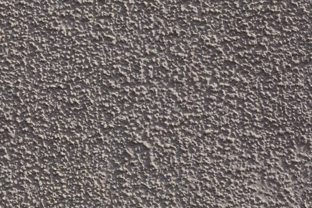 istock Texture of rough decorative plaster with shadows. Painted uneven wall surface. Design element 1315471201