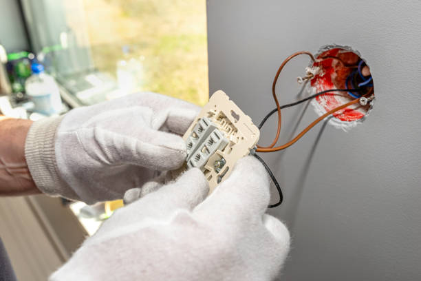 istock The electrician puts the roller shutter switch up and down in the electrical box in the room by the window. 1315474888