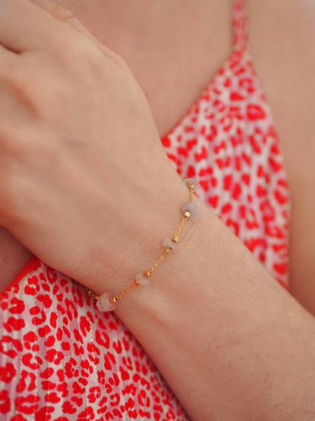 istock Rose Quartz bracelet on a pink leopard dress 1315476758