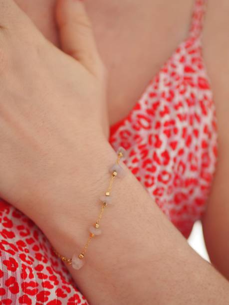 istock Rose Quartz bracelet on a pink leopard dress 1315476764
