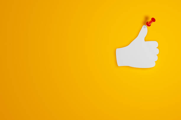 istock Pin Paper Thumbs Up Symbol on Yellow Background 1315478449
