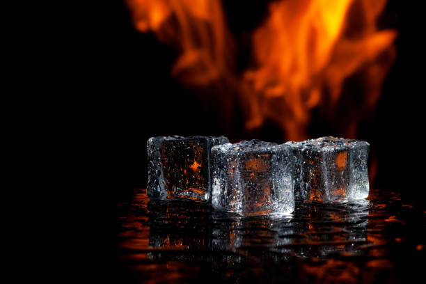 istock three ice cubes against the background of fire, concept 1315483384