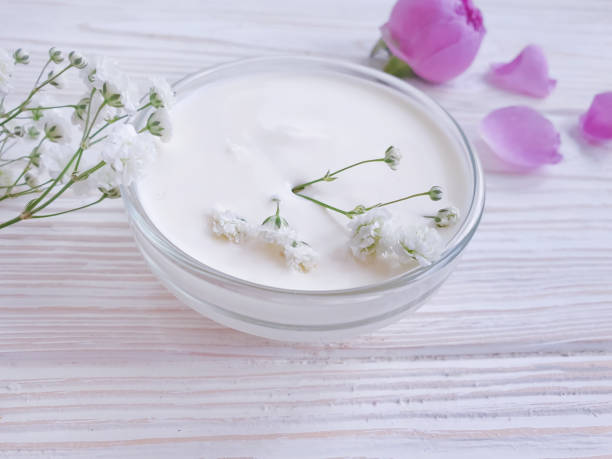 istock flower rose cream on wooden background 1315483725