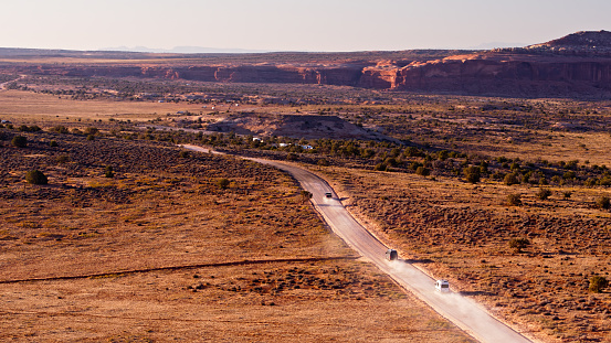 Drone shot of the stunning landscape around Utah SR 313, also known as the Dead Horse Mesa Scenic Byway, near the town of Moab and between Arches and Canyonlands National Parks.